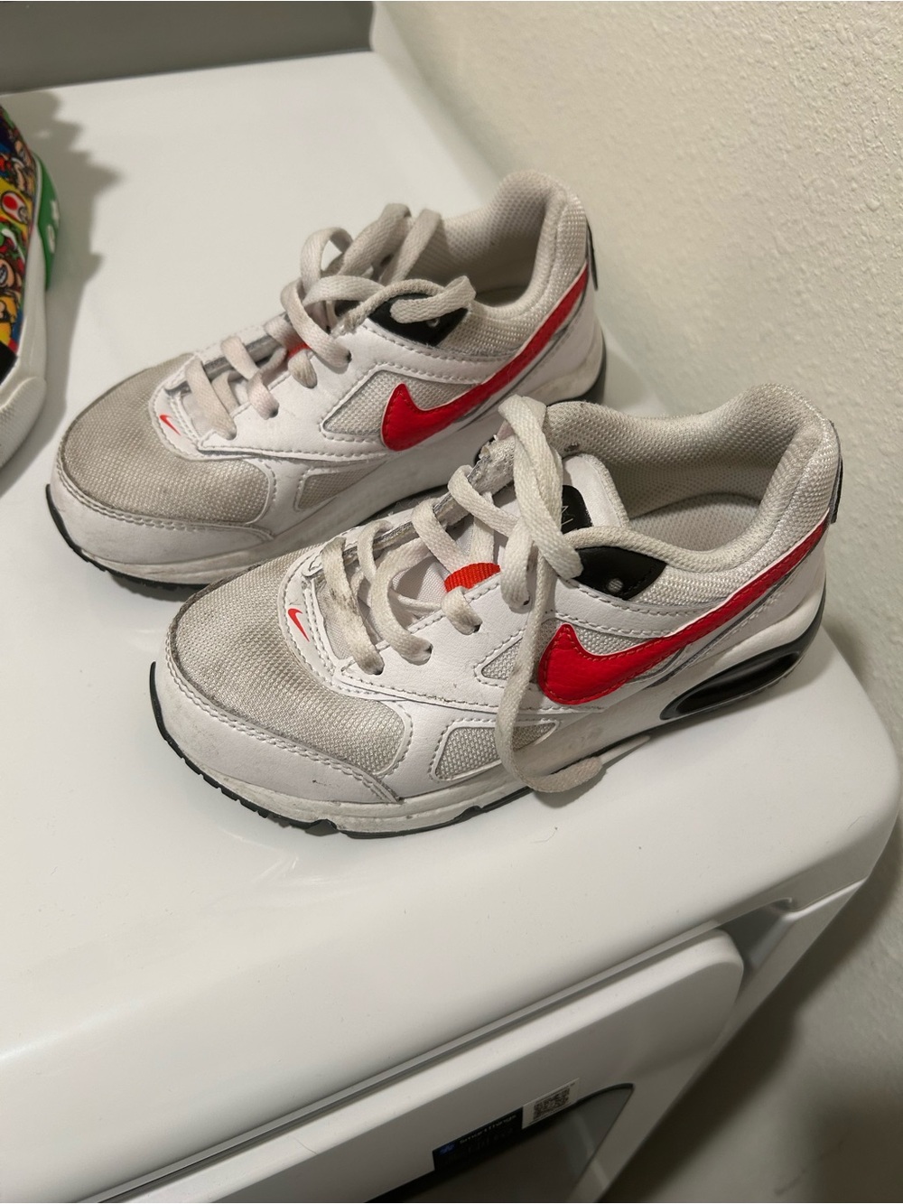 Nike Kids White Sneakers with Red Swoosh